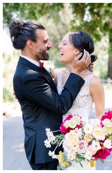 Bride and groom laughing together — De Joy Photography