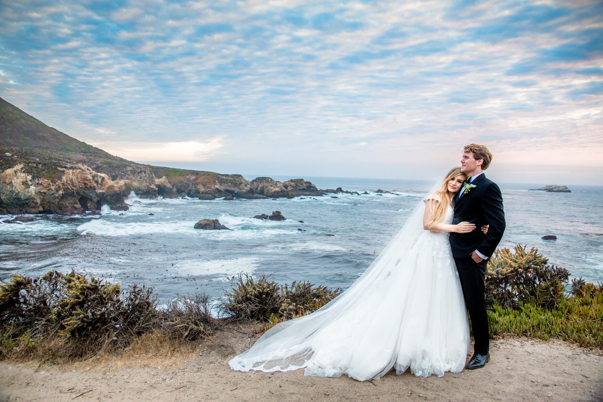 Wedding photography by De Joy Photography, couple portraits on a dramatic coastline